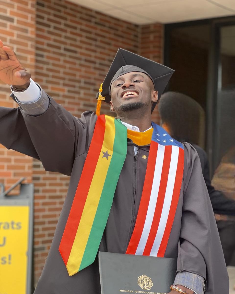 Ebenezer Adarkwa Yiadom at his Michigan Technological University graduation, wearing Ghana and United States stoles